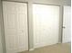 Bedroom with bi-fold closet doors and access to a doorway at 11495 Sw 138Th Ln, Dunnellon, FL 34432