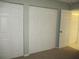 Bedroom with bi-fold closet doors and an open doorway at 11495 Sw 138Th Ln, Dunnellon, FL 34432