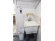 Laundry room sink with overhead wire rack and white walls at 11495 Sw 138Th Ln, Dunnellon, FL 34432