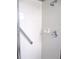 Shower showcasing white tiles, shower head, grab bar, and soap dish at 11495 Sw 138Th Ln, Dunnellon, FL 34432