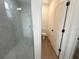 Bathroom features a glass shower and a separate toilet room at 11555 Sw 59Th Ter, Ocala, FL 34476