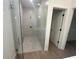 Modern bathroom featuring a glass-enclosed shower and tile flooring at 11555 Sw 59Th Ter, Ocala, FL 34476