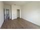 This bedroom offers wood-look tile flooring and a closet with sliding doors at 11555 Sw 59Th Ter, Ocala, FL 34476