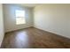 This bedroom offers lots of light from the window and stylish wood-look tile floor at 11555 Sw 59Th Ter, Ocala, FL 34476