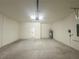 Spacious attached garage with a freshly painted concrete floor and plenty of room at 11555 Sw 59Th Ter, Ocala, FL 34476