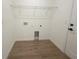Laundry room with tile flooring, washer and dryer hookups, and white walls at 11555 Sw 59Th Ter, Ocala, FL 34476