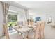 Inviting dining space featuring a table set for a meal with views of the backyard at 13782 Sw 40Th Avenue Rd, Ocala, FL 34473