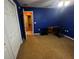Cozy bedroom with blue walls, carpet floors and a ceiling fan at 15115 Se 94Th Ct, Summerfield, FL 34491