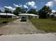 Well-maintained single-story home, driveway and green lawn in a quiet neighborhood at 15115 Se 94Th Ct, Summerfield, FL 34491