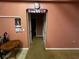 Hallway featuring carpeted floors and doorway at 15115 Se 94Th Ct, Summerfield, FL 34491