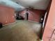 Large living room featuring carpeted floors, neutral paint, and a ceiling fan at 15115 Se 94Th Ct, Summerfield, FL 34491