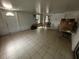 Indoor area featuring tile flooring, white door, and window at 15115 Se 94Th Ct, Summerfield, FL 34491