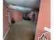 Spacious living room with carpet, ceiling fan, and neutral paint, ready for customization at 15115 Se 94Th Ct, Summerfield, FL 34491