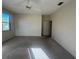 Spacious bedroom featuring a ceiling fan and large windows for ample natural light at 1703 Sanderling St, The Villages, FL 32162