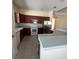 Features of this kitchen include an island, updated appliances, and ample storage space at 1703 Sanderling St, The Villages, FL 32162