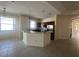 Open kitchen and breakfast nook with stainless steel appliances and breakfast bar at 1703 Sanderling St, The Villages, FL 32162