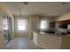 Bright kitchen and breakfast nook featuring ample counter space and natural light at 1703 Sanderling St, The Villages, FL 32162