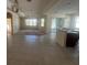 The open-plan living area features tile flooring and a seamless transition to outdoor spaces at 1703 Sanderling St, The Villages, FL 32162