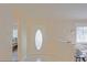Bright entryway featuring a decorative glass door and views into the living room at 17475 Se 107Th Ct, Summerfield, FL 34491