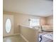 Inviting entryway with an accent wall and partial view of the cozy living room at 17475 Se 107Th Ct, Summerfield, FL 34491