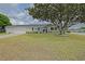 Charming single-story home with a well-maintained lawn and mature landscaping at 17475 Se 107Th Ct, Summerfield, FL 34491