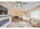 Open-concept living area featuring a modern fireplace, hardwood floors and easy access to the dining room at 17475 Se 107Th Ct, Summerfield, FL 34491