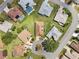 Aerial view of a residential neighborhood highlighting well-manicured lawns and a cul-de-sac street at 17645 Se 117Th Cir, Summerfield, FL 34491