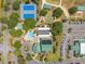Overhead shot of community amenities, including a pool, tennis courts, and well-maintained landscaping at 17645 Se 117Th Cir, Summerfield, FL 34491