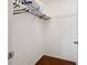 Bright walk-in closet with wood floor, white walls and a wire shelving system for optimal organization at 17645 Se 117Th Cir, Summerfield, FL 34491