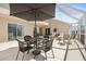 Screened-in patio area with dining table and cushioned seating, perfect for outdoor relaxation at 17645 Se 117Th Cir, Summerfield, FL 34491