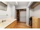 Bathroom featuring vanity with storage and view into walk-in closet at 2042 Se 37Th Court Circle Cir, Ocala, FL 34471