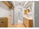Well-lit bathroom with vanity and walk-in closet featuring wooden floors at 2042 Se 37Th Court Circle Cir, Ocala, FL 34471