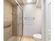 Tiled walk-in shower with glass door and toilet at 2042 Se 37Th Court Circle Cir, Ocala, FL 34471