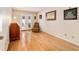 Bedroom with hardwood floors, a desk, and a glass-paned door leading to the outside at 2042 Se 37Th Court Circle Cir, Ocala, FL 34471