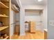 Organized walk-in closet with shelving and drawers for ample storage in a bedroom at 2042 Se 37Th Court Circle Cir, Ocala, FL 34471