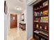 Charming entryway with wooden door, console table, and convenient built-in shelving at 2042 Se 37Th Court Circle Cir, Ocala, FL 34471