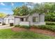 Charming home featuring a well-maintained lawn and beautiful landscaping at 2042 Se 37Th Court Circle Cir, Ocala, FL 34471