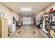 Spacious garage with ample storage, including shelving, and room for parking, providing organization and convenience for homeowners at 2042 Se 37Th Court Circle Cir, Ocala, FL 34471