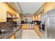 Open concept kitchen with stainless steel appliances and granite countertops with an open view to another room at 2042 Se 37Th Court Circle Cir, Ocala, FL 34471
