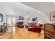Bright living room with a fireplace, wood floors, and a comfortable seating area at 2042 Se 37Th Court Circle Cir, Ocala, FL 34471