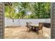 Outdoor patio with a table and chairs, perfect for enjoying a meal, entertaining, or relaxing in a private and inviting setting at 2042 Se 37Th Court Circle Cir, Ocala, FL 34471