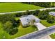 Aerial view of home showcasing the lush landscaping and a driveway at 2358 Nw 59Th Ter, Ocala, FL 34482