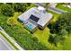 Aerial view of property featuring a pool within a screened-in lanai at 2358 Nw 59Th Ter, Ocala, FL 34482