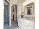 Accessible bathroom featuring a walk-in shower with a seat and a vanity with a white cabinet at 2358 Nw 59Th Ter, Ocala, FL 34482