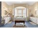 Bright bathroom features a soaking tub, separate vanities, and natural light at 2358 Nw 59Th Ter, Ocala, FL 34482