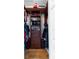 Organized walk-in closet featuring built-in shelving and wooden floor at 2358 Nw 59Th Ter, Ocala, FL 34482