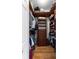 Organized walk-in closet featuring built-in shelving and wooden floor at 2358 Nw 59Th Ter, Ocala, FL 34482