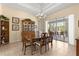 Dining area featuring an elegant chandelier, wooden table, and sliding glass doors leading to the patio at 2358 Nw 59Th Ter, Ocala, FL 34482
