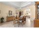 Charming dining room with a decorative chandelier, classic furnishings, and seamless flow to the living area at 2358 Nw 59Th Ter, Ocala, FL 34482