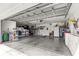 Spacious garage with epoxy flooring, shelving, and plenty of storage at 2358 Nw 59Th Ter, Ocala, FL 34482